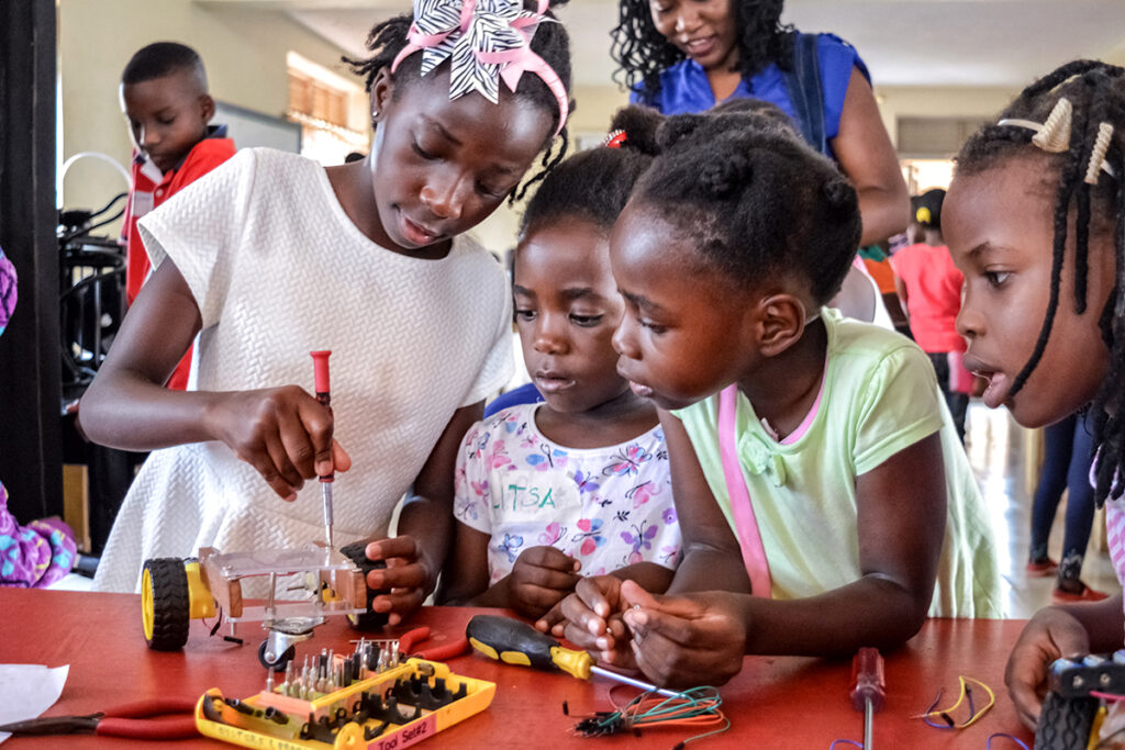 children building a robot (rover)